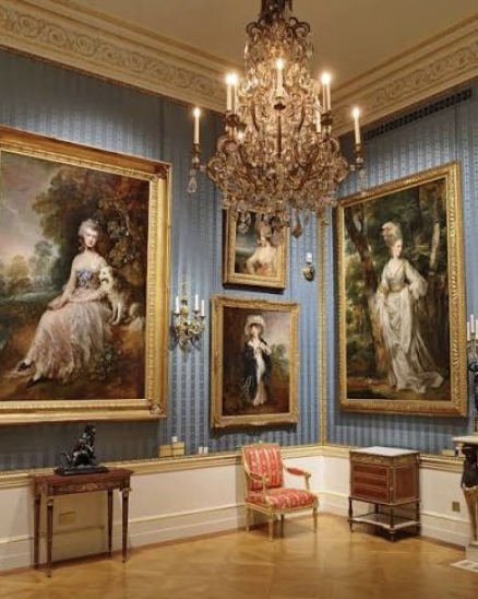 A chandelier and paintings inside the Wallace Collection